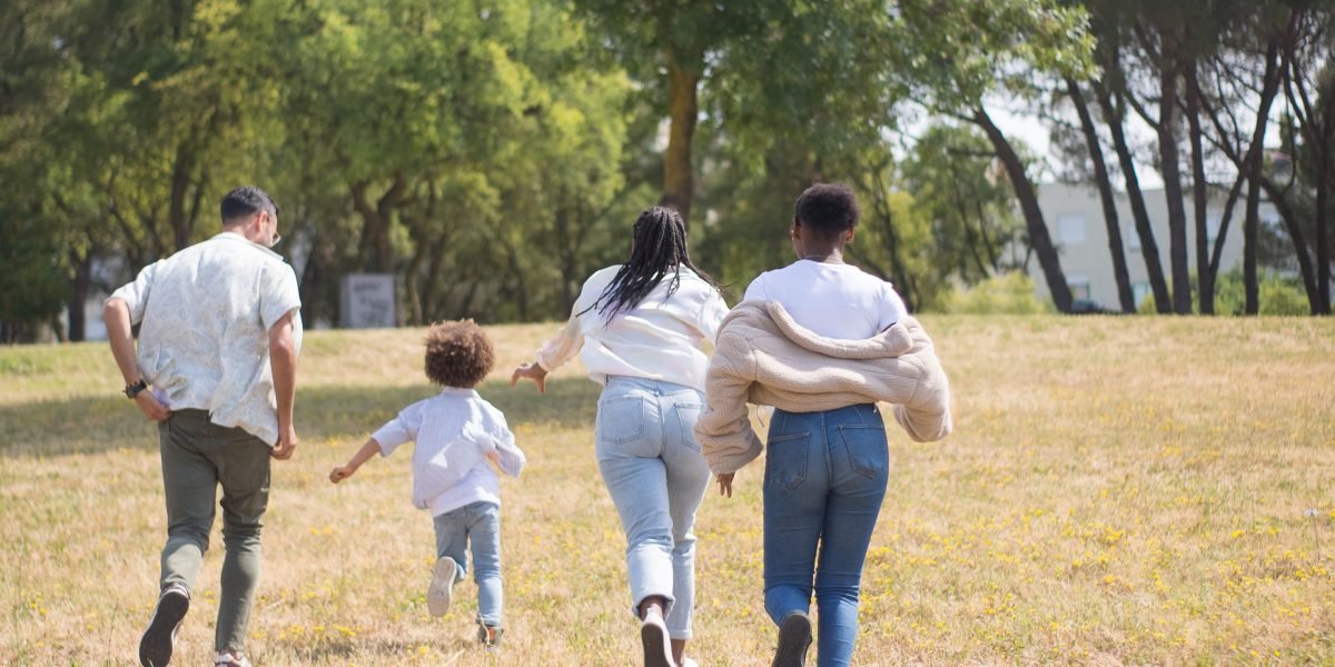 A family enjoying a serene, green oasis-style community, highlighting the lifestyle benefits of master-planned areas.