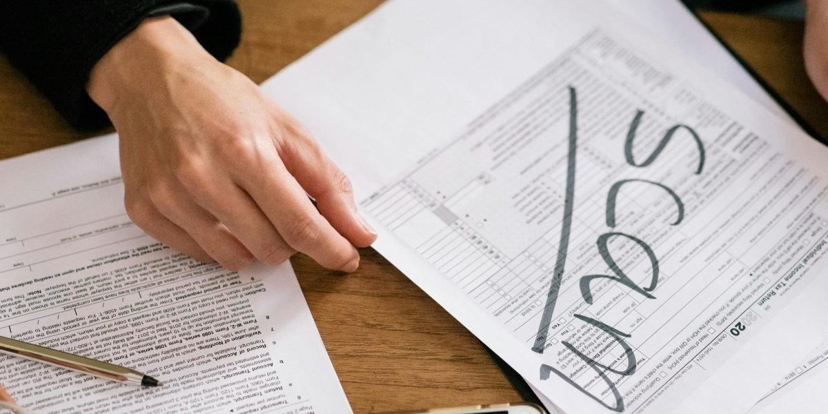 An individual appears concerned while reviewing complex documents, illustrating the potential pitfalls in property transactions.