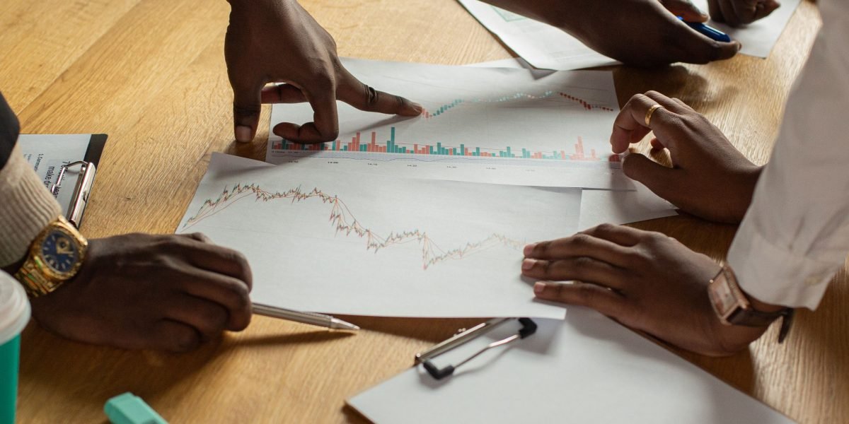 Professionals discussing market trends, symbolizing the deep research required to understand Dubai's apartment market.