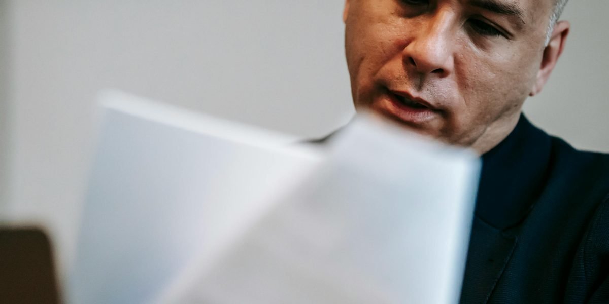 A person reviews documents, making a confident and informed real estate investment decision.