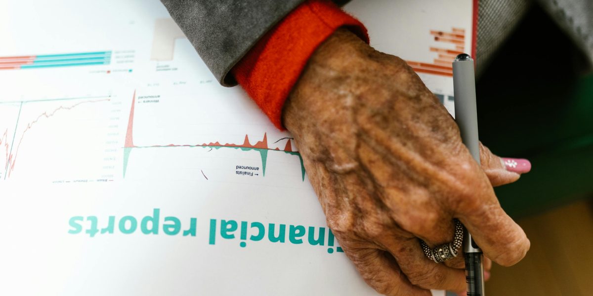 A person confidently reviews investment documents, symbolizing strategic planning in the global luxury real estate market.