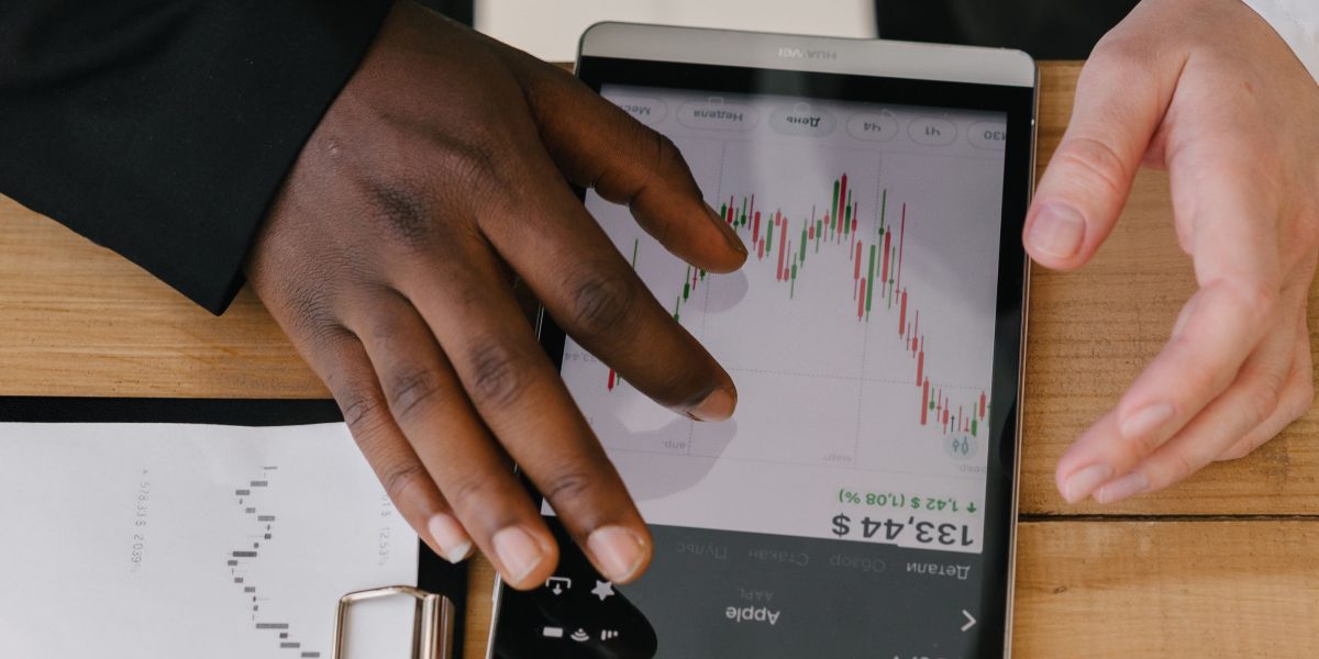 A group of investors or advisors meticulously analyzing financial data and charts to make informed decisions.