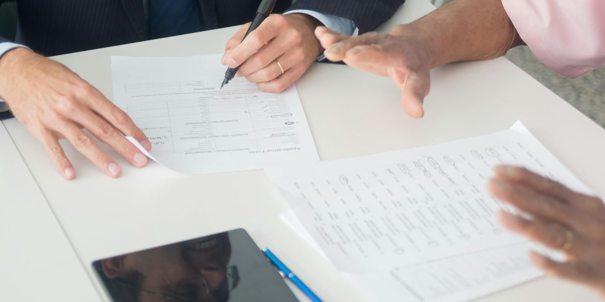 Prospective buyers consulting with real estate experts, ensuring a smooth and secure property transaction in Dubai.