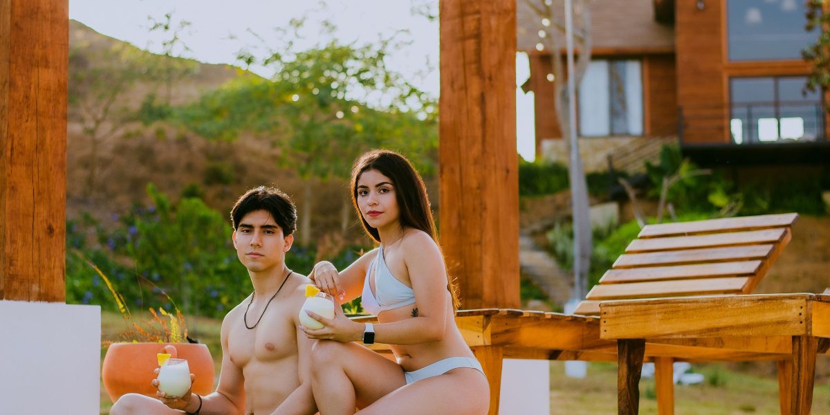 A couple enjoying the peaceful, private setting of a luxury villa garden, embodying the oasis-style living experience.