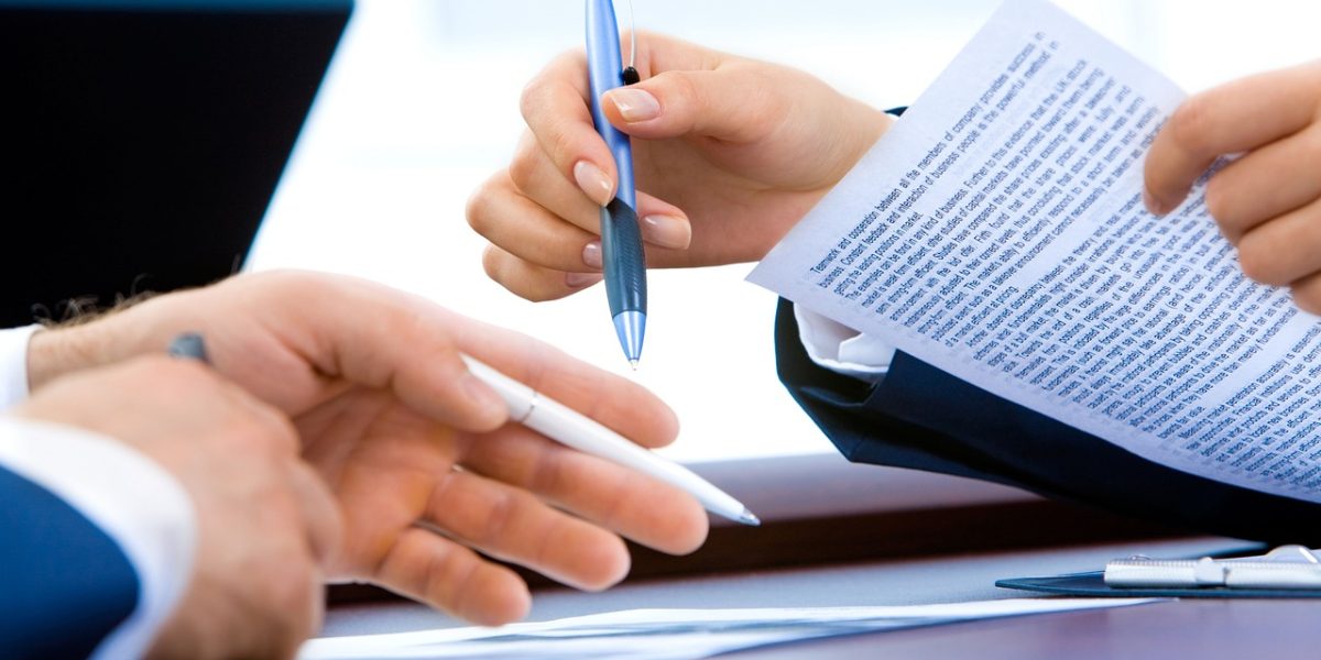 A confident individual meticulously reviewing contract documents, ensuring all details are verified before making a commitment.