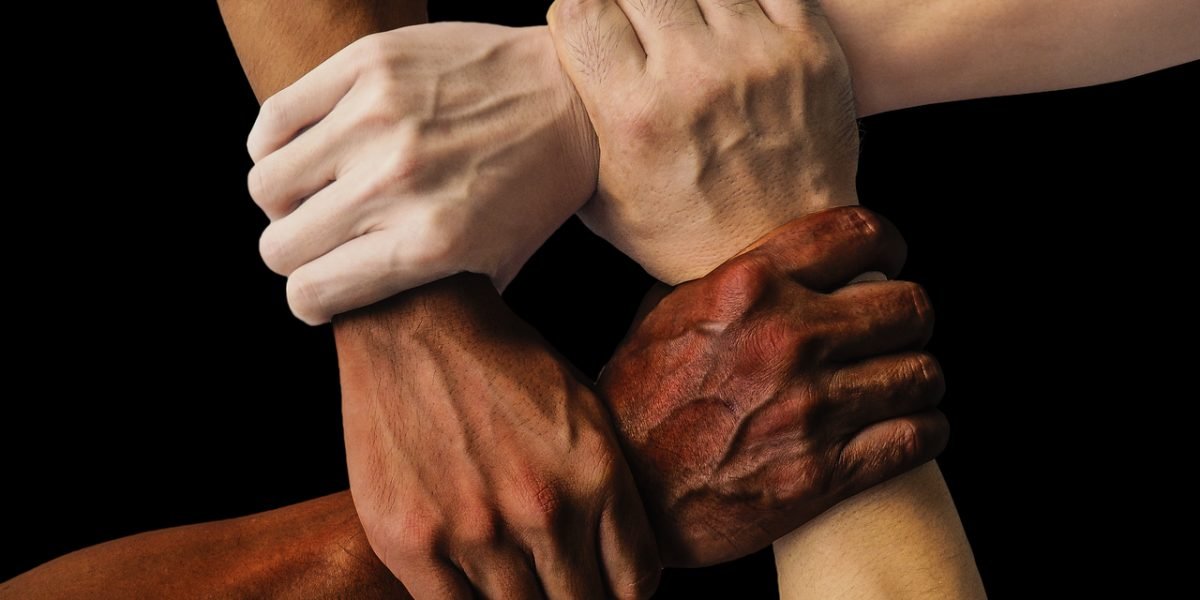 A diverse group of people collaborating, reflecting the importance of finding a compatible and effective consultant.