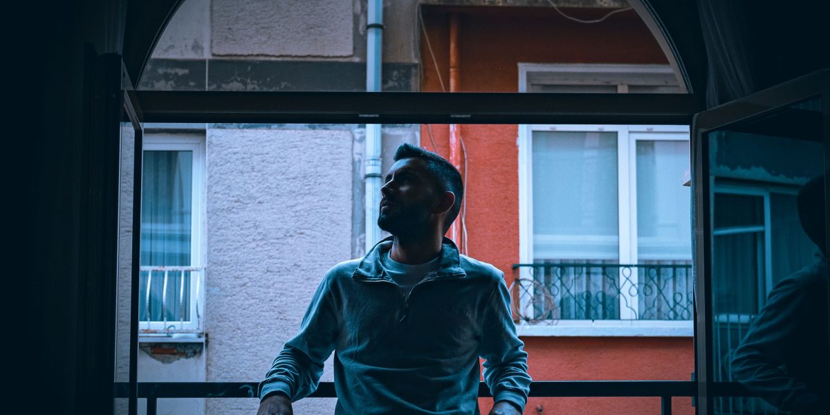 A person contemplating investment decisions, reflecting the initial stage of property search.