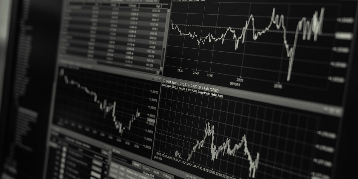 An investor confidently reviewing positive market data, dispelling crash fears.
