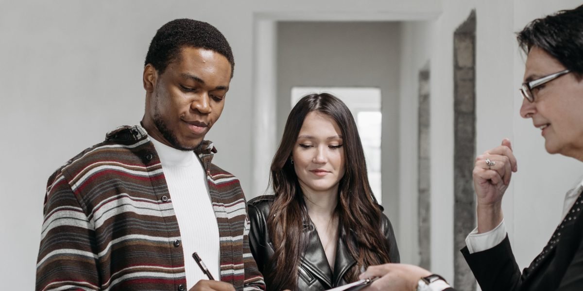 A professional finalizes a property agreement, a crucial step in the villa buying process.