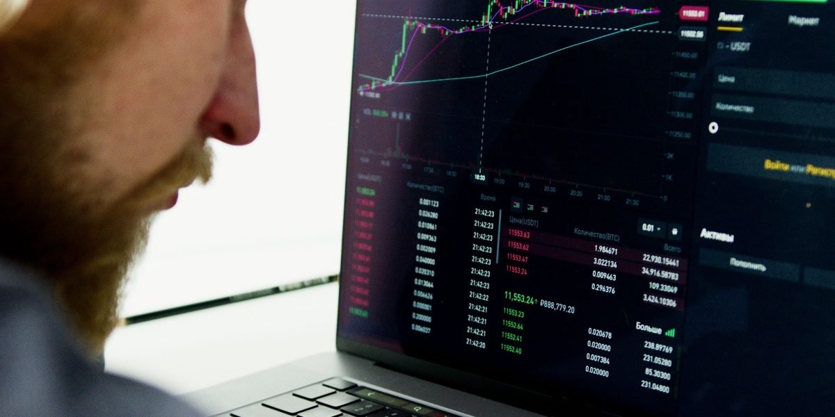 A professional analyzing market data to make informed investment decisions.