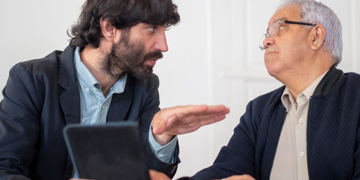 An expert real estate consultant discussing market trends and options with a client in a comfortable setting.