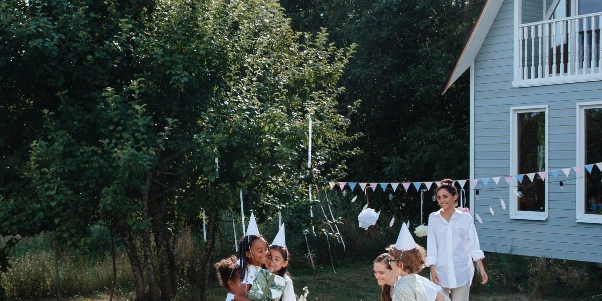 A happy family enjoying quality time in a spacious green garden, reflecting the ideal 'oasis-style' living in Dubai.