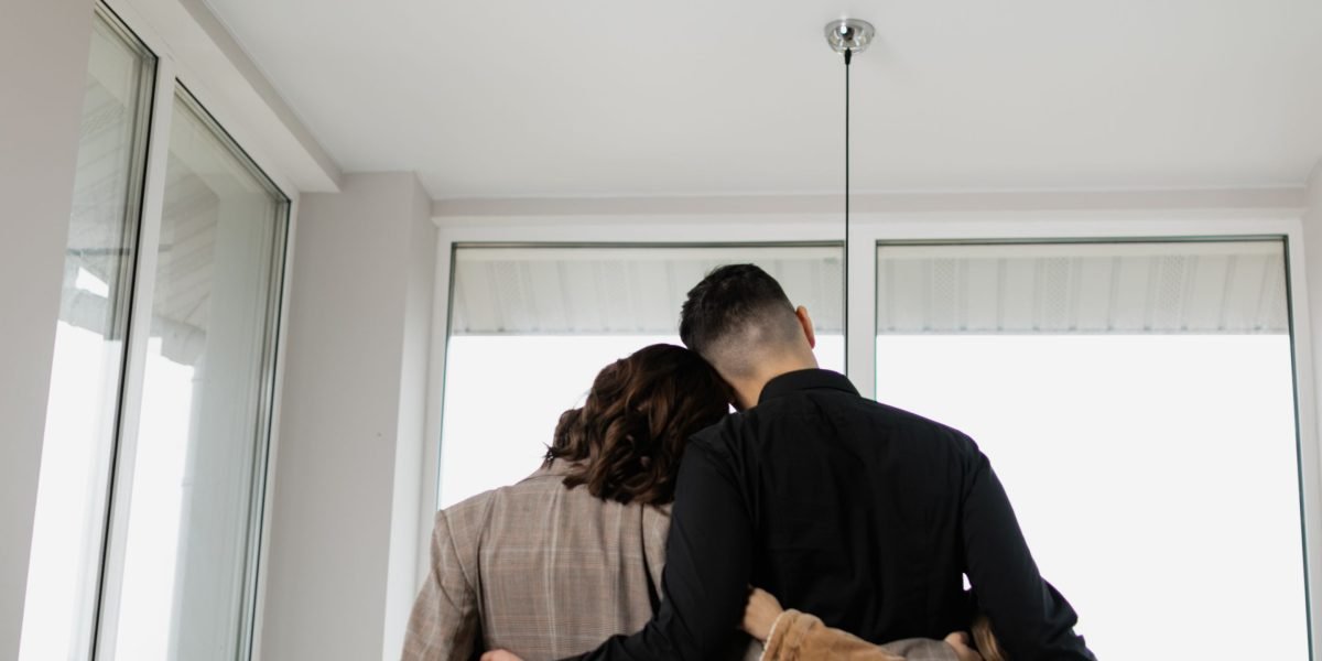 A family visualizes their future in a new villa, highlighting the emotional aspect of home buying.