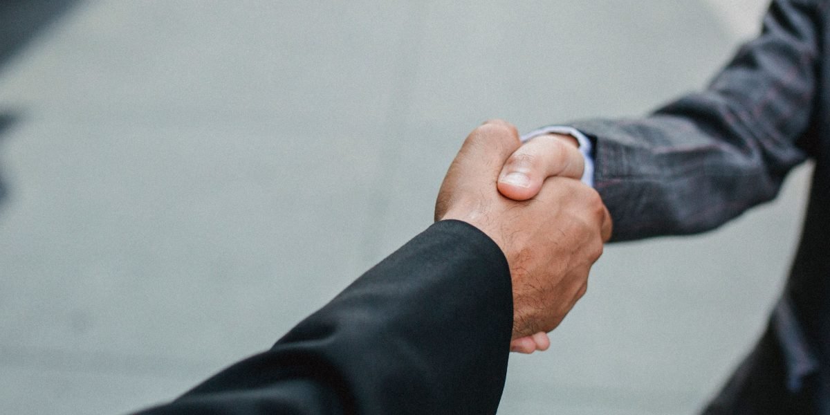 A handshake symbolizes the successful completion of a property transaction in Dubai.